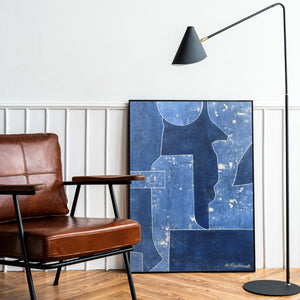 Blue abstract artwork with white lines placed against wall - Studio 2 Art & Design